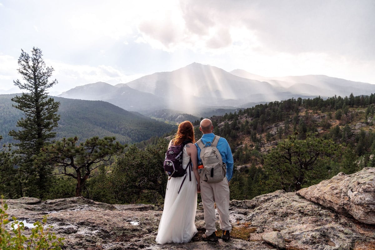 Couple takes in the view at their mountain elopement